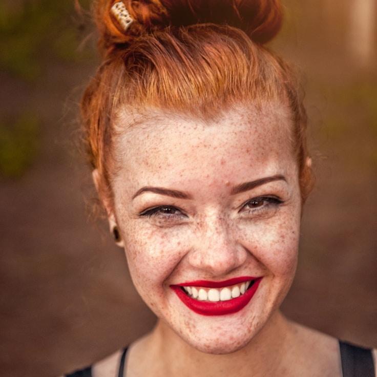Kaveri Mehta, Lead Design Curator at Adaptive Health Pathway, reviewing corporate floral arrangements
